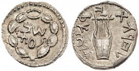 Judaea, Bar Kokhba Revolt. Silver Zuz (2.88 g), 132-135 CE. Undated, attributed to year 3 (134/5 CE). 'Simon' (Paleo-Hebrew) within wreath of thin bra...