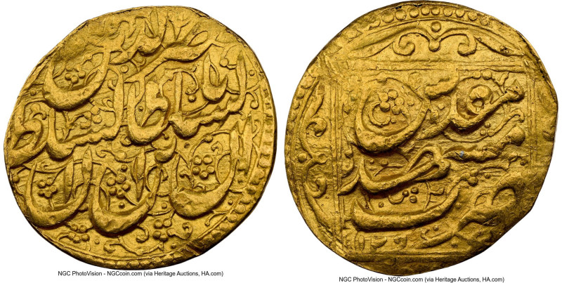 Qajar. Nasir al-Din Shah (AH 1264-1313 / AD 1848-1896) gold Toman ND Clipped NGC...