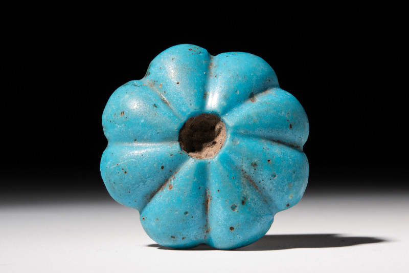 EGYPTIAN AMARNA PERIOD FAIENCE FLORETTE

 New Kingdom, Amarna Period, Ca. 1352...