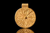 EARLY GREEK GOLD SUN DISC FILIGREE PENDANT 

 Ca. 600-400 BC
 A gold pendant in the form of flat disc featuring a central raised knob from which em...