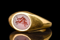 RARE ROMAN GOLD RING WITH A PAIR OF GRASSHOPPERS INTAGLIO - WITH REPORT

 Ca. AD 100-200
 A gold finger ring set with a carnelian intaglio featurin...