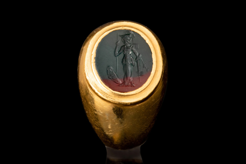 ROMAN MINERVA INTAGLIO IN GOLD RING

 Ca. 1st century AD
 A black oval-shaped...