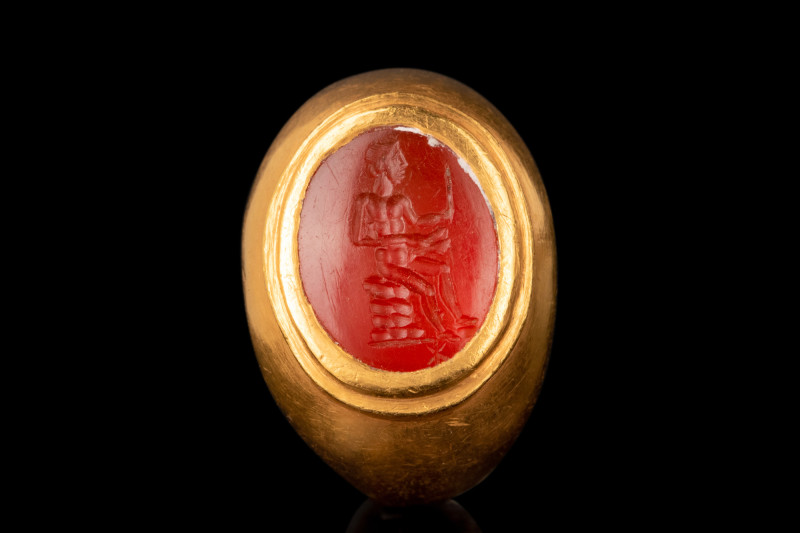 ROMAN MERCURY CARNELIAN INTAGLIO IN GOLD RING

 Ca. 1st-2nd century AD
 An ov...