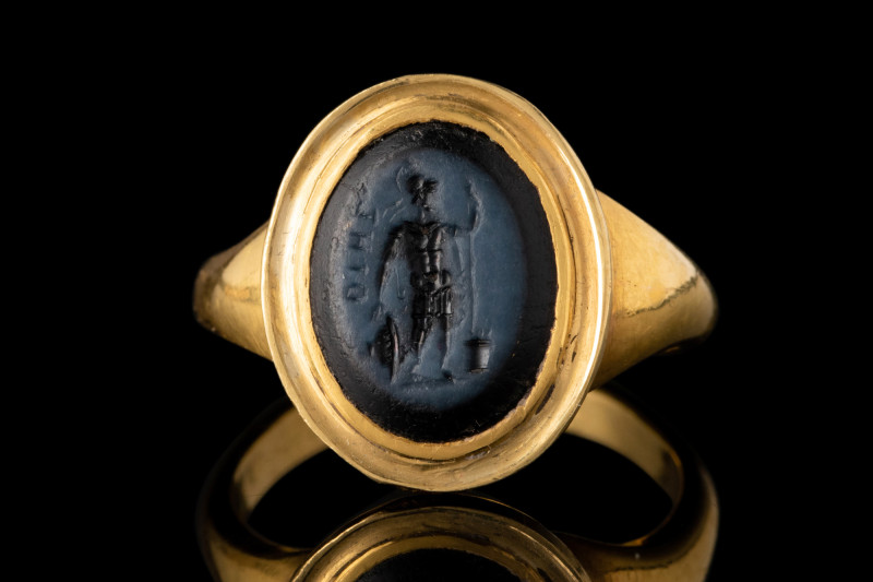 ROMAN NICOLO INTAGLIO WITH MARS IN GOLD RING

 Ca. 1st century AD
 A nicolo i...