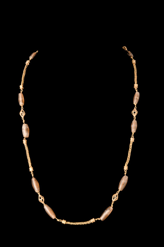 ROMAN GOLD NECKLACE WITH STONE BEADS

 Ca. AD 100-300
 A sophisticated gold n...