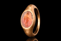 ROMAN GOLD RING WITH MERCURY INTAGLIO

 Ca. AD 300
 A gold finger ring of Hening type X. Its D-shaped hoop expands gradually to form a recessed set...