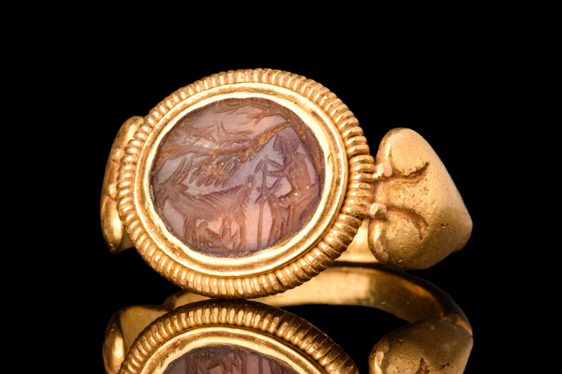 LATE ROMAN GOLD RING WITH A BUCOLIC SCENE INTAGLIO

 Ca. AD 400
 A D-shaped g...