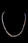 ROMAN GOLD AND STONE NECKLACE

 Ca. AD 1-300
 A restrung necklace composed of alternating gold and lapis lazuli beads, exhibiting a diverse array o...