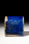 EGYPTIAN LAPIS LAZULI HALF CYLINDER INLAY

 New Kingdom, Ca. 1550 - 1070 BC
 An inlay displaying a vibrant cobalt blue glaze. The inlay features a ...