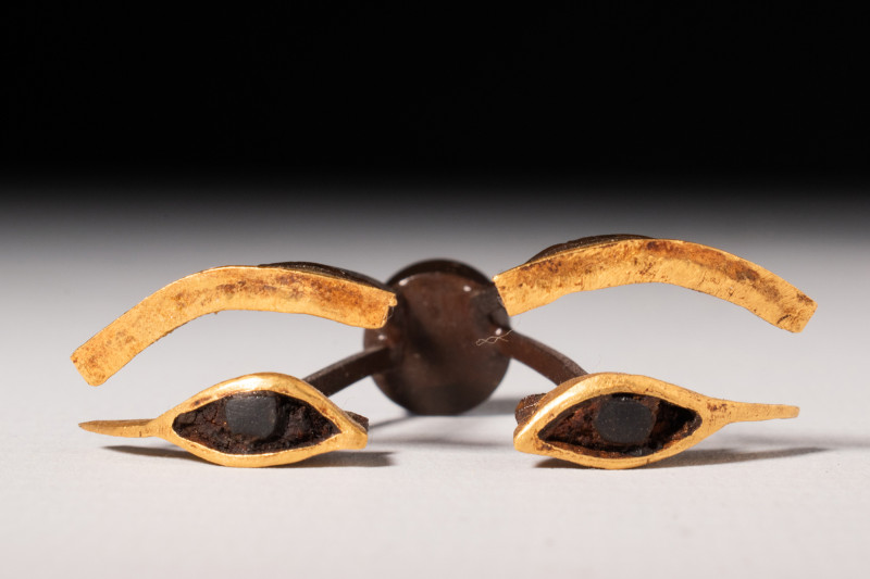 EGYPTIAN GOLD EYE AND BROW INLAYS

 New Kingdom, Ca. 1550 - 1070 BC
 A gold e...