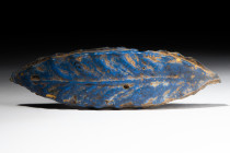 EGYPTIAN GLASS LEAF AMULET

 New Kingdom, Amarna Period, Reign of Akhenaton, Ca. 1352 - 1336 BC 
 A vibrant blue glass example of an Egyptian petal...