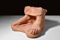 LIFE-SIZE ETRUSCAN TERRACOTTA PAIR OF FEET FROM A STATUE 

 Ca. 3rd-2nd century BC
 A near life-size, naturalistically modelled pair of feet with a...