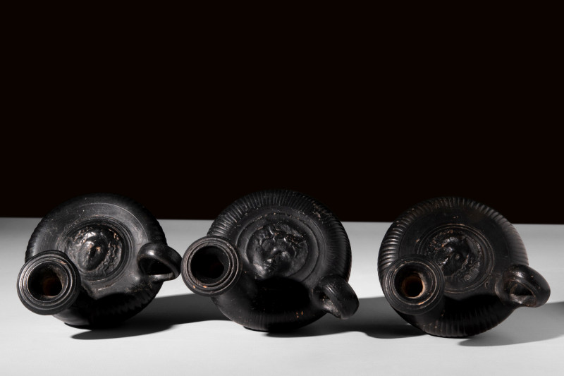 GROUP OF THREE GREEK BLACK-GLAZED GUTTI

 Ca. 4th century BC
 A nice group of...