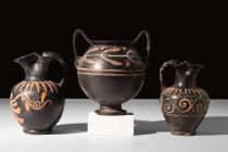 GROUP OF THREE APULIAN XENON WARE VESSELS

 Ca. 350 BC
 A set of three vessels belonging to the Xenon ware, comprising two oinochoi and a kantharos...