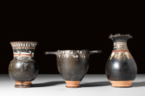 GROUP OF 3 POTTERY GNATHIAN-WARE VESSELS 

 Ca. 4th century BC
 A group of three pottery Gnathian-ware vessels, exemplifying the characteristic bla...