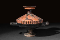 APULIAN RED-FIGURE LEKANIS WITH LADIES OF FASHION

 Ca. 340-325 BC
 A terracotta red-figure lekanis consisting of a black-glazed footed dish with t...