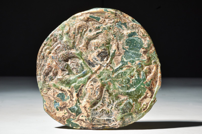 ROMAN GLASS FRAGMENT

 Ca. AD 100 - 300
 A fragment of glass in round conical...