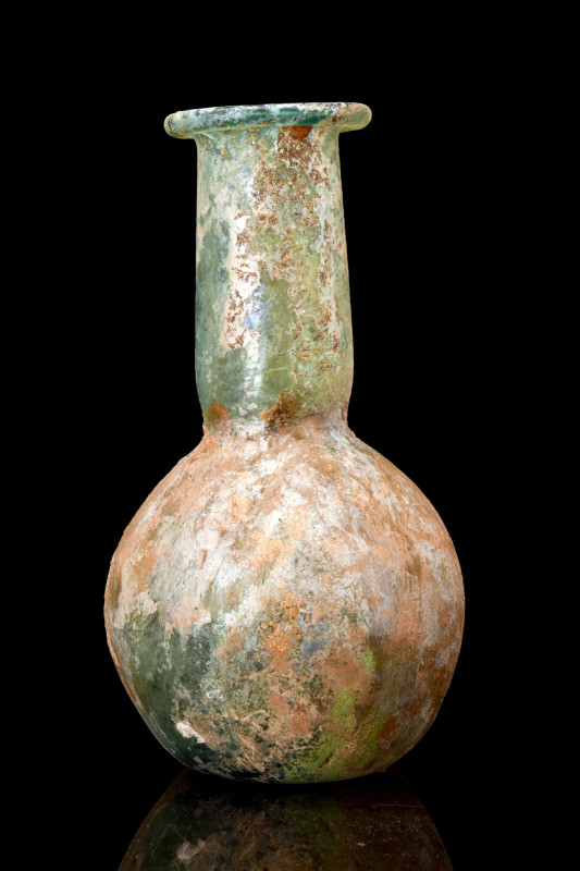 LARGE ROMAN GLASS UNGUENTARIUM

 Ca. AD 200-300
 An unguentarium blown from g...