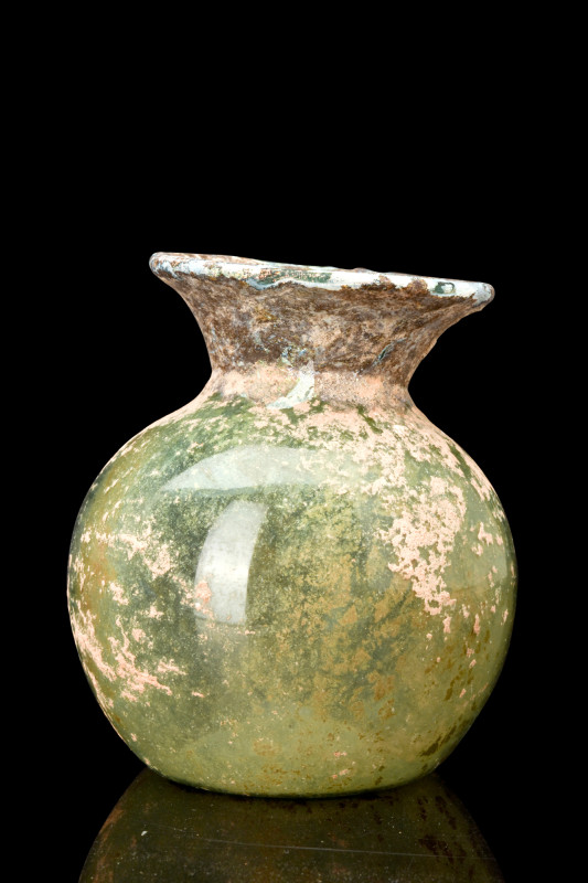 ROMAN GLASS FLASK

 Ca. AD 200-300
 A free-blown flask of transparent green g...