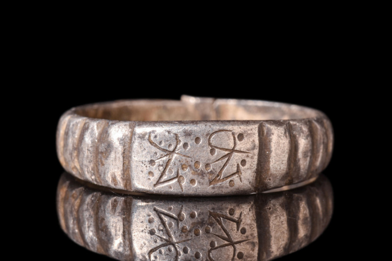 LATE MEDIEVAL SILVER WEDDING BAND WITH INITIALS

 Ca. AD 15th century
 A silv...