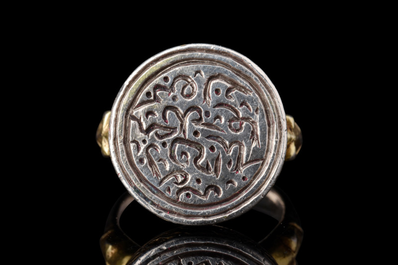 EARLY OTTOMAN SILVER GILT RING WITH CALLIGRAPHY

 Ca. early 14th century AD
 ...