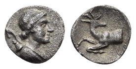 IONIA. Ephesos.(Circa 245-202 BC).Obol.

Obv : Draped bust of Artemis right, with quiver over shoulder.

Rev : Forepart of stag kneeling right, head l...