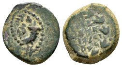 JUDAEA. Hasmoneans. John Hyrkanos II.(67/3-40 BC).Jerusalem.Ae.

Obv : Splayed double cornucopia with pomegranate between the horns.

Rev : Legend in ...