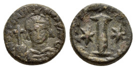 JUSTINUS I (518-527).Rome.Decanummium.

Obv : D N IVSTINIA NVS P AVG.
Helmeted and cuirassed bust facing, holding globus cruciger in right hand and sh...