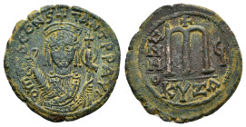 TIBERIUS II CONSTANTINE (578-582).Cyzicus.Follis.

Obv : D m TIB CONSTANT P P AVC.
Crowned bust facing, wearing consular robes and holding mappa and e...