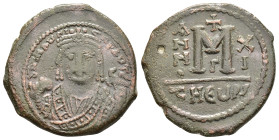 MAURICE TIBERIUS.(582-602).Antioch.Follis.

Obv : D N MAURI C N P AVT.
Crowned facing bust, wearing consular robes, holding mappa and eagle-tipped sce...