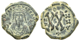 PHOCAS (602-610).Antioch. Half Follis.

Obv : ON FOCA NE PE AV.
Crowned and mantled bust facing, holding mappa and eagle-tipped sceptre.

Rev : Large ...