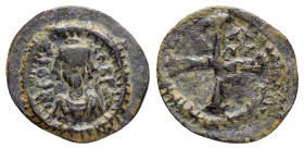 PHOCAS (602-610). Constantinople. Decanummium.

Obv : ON FOCAS PЄRP AVG.
Crowned, draped and cuirassed bust facing, holding globus cruciger and shield...