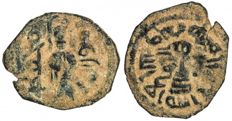 ARAB-BYZANTINE: Standing Caliph, ca. 692-697, AE fals (2.84g), al-Ruha, ND, A-35...