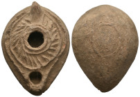 ANCIENT ROMAN COOKED EARTH OIL LAMP.
.
Weight: 81.69 g.
Diameter: 83.6 mm