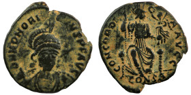 Honorius. (401-403 AD). Follis. (18mm, 1,79g) Constantinople. Obv: DN HONORIVS PF AVG. helmeted bust of Honorius holding spear and shield facing. Rev:...