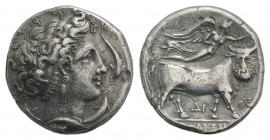 Southern Campania, Neapolis, c. 300 BC. AR Didrachm (20mm, 6.59g, 9h). Head of nymph to r., four dolphins around. R/ Man-headed bull walking r., crown...