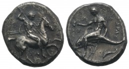 Southern Apulia, Tarentum, c. 315-302 BC. AR Nomos (21mm, 7.48g, 1h). Warrior, holding shield and two spears, preparing to cast a third, on horseback ...