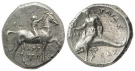 Southern Apulia, Tarentum, c. 302-280 BC. AR Nomos (21mm, 7.77g, 3h). Youth on horseback r., crowning horse; ΣA to l., APE/ΘΩN in two lines below. R/ ...