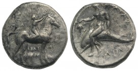 Southern Apulia, Tarentum, c. 302-280 BC. AR Nomos (21mm, 7.52g, 1h). Youth on horseback r., crowning horse with wreath; ΣA to l., ΦIΛI/APXOΣ in two l...