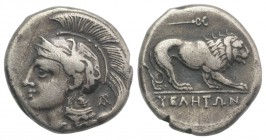 Northern Lucania, Velia, c. 280 BC. AR Didrachm (20mm, 7.35g, 3h). Helmeted head of Athena l., helmet decorated with griffin; Φ on neck guard, AP mono...