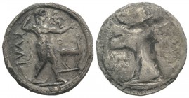 Bruttium, Kaulonia, c. 525-500 BC. AR Stater (29mm, 7.69g, 12h). Apollo advancing r., holding branch; small daimon running r. on Apollo's l. arm; to r...