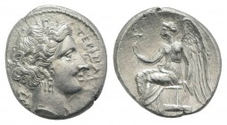 Bruttium, Terina, c. 300 BC. AR Drachm (14mm, 2.06g, 7h). Head of nymph r.; triskeles behind. R/ Nike seated l. on plinth, holding kerykeion. Holloway...