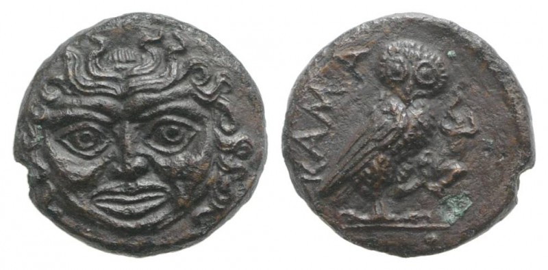 Sicily, Kamarina, c. 420-405 BC. Æ Onkia (10mm, 1.09g, 12h). Facing gorgoneion. ...
