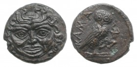 Sicily, Kamarina, c. 420-405 BC. Æ Onkia (10mm, 1.09g, 12h). Facing gorgoneion. R/ Owl standing r., head facing, grasping lizard in talons. CNS III, 4...