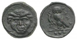 Sicily, Kamarina, c. 420-405 BC. Æ Tetras (14mm, 3.90g, 12h). Gorgoneion. R/ Owl standing l., head facing, holding lizard in talon. CNS III, 21; SNG A...