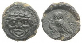 Sicily, Kamarina, c. 420-410 BC. Æ Tetras (14mm, 3.70g, 7h). Gorgoneion. R/ Owl standing l., head facing, holding lizard in talon. CNS III, 24; HGC 2,...
