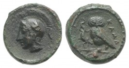 Sicily, Kamarina, c. 410-405 BC. Æ Onkia (10mm, 1.19g, 12h). Helmeted head of Athena l. R/ Owl standing l., grasping lizard; pellet in exergue. CNS II...