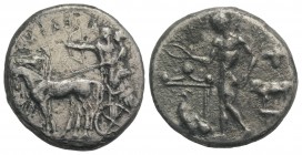 Sicily, Selinos, c. 455-409 BC. AR Tetradrachm (27mm, 15.18g, 3h). Artemis, holding reins, driving quadriga l.; beside her, Apollo standing l., drawin...