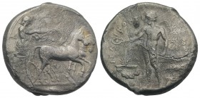 Sicily, Selinos, c. 440-420 BC. AR Tetradrachm (27mm, 16.30g, 11h). Artemis, holding reins, driving quadriga l.; beside her, Apollo standing l., drawi...