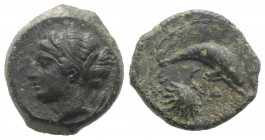 Sicily, Syracuse, c. 415-405 BC. Æ Hemilitron (15.5mm, 3.53g, 9h). Head of Arethusa l., hair bound in ampyx and sphendone; two leaves to r. R/ Dolphin...
